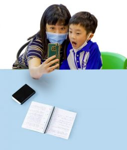 A student and his mother posing for a photo.